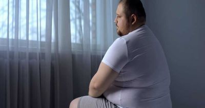 How is obesity linked to erectile dysfunction?